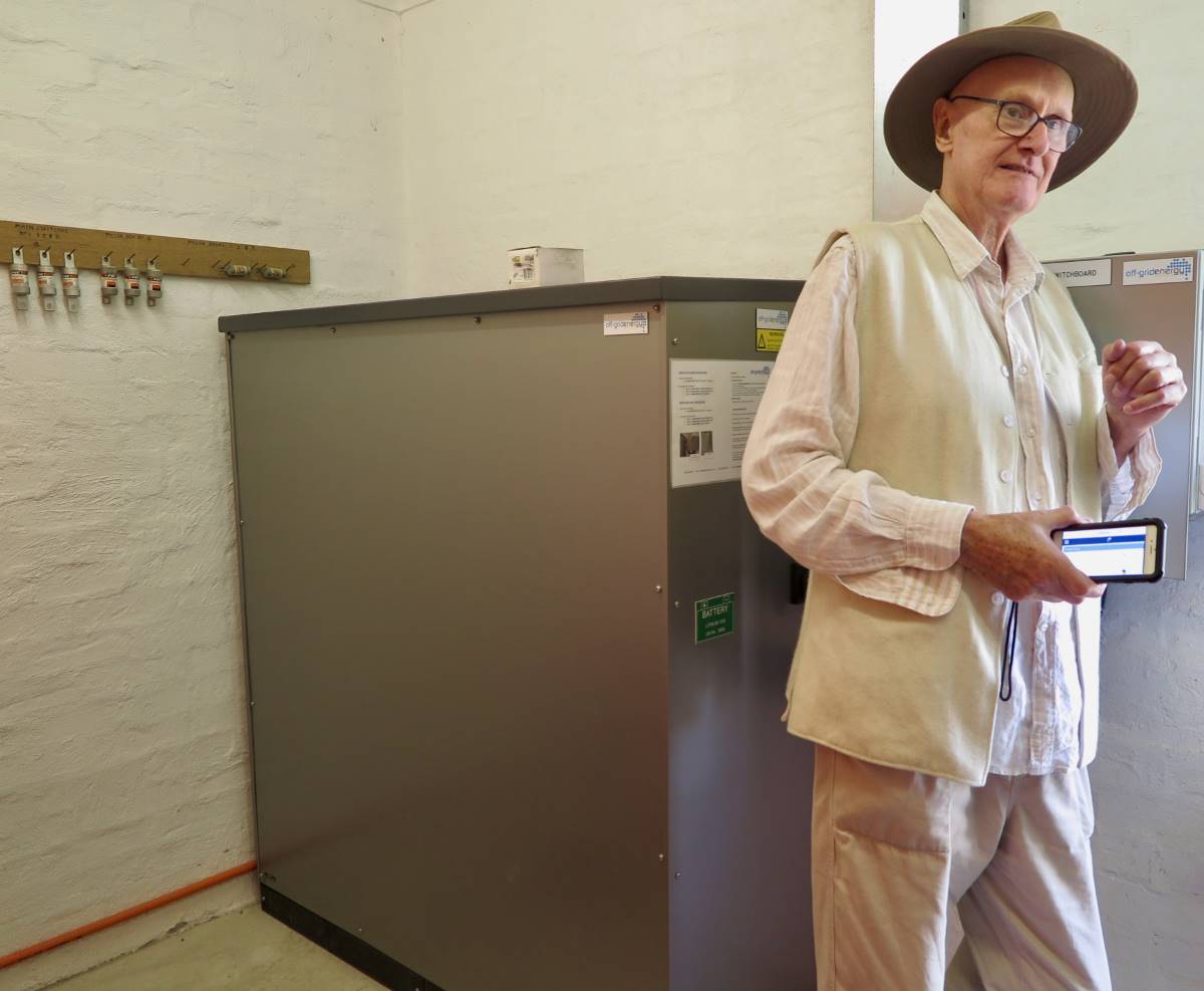 Greg Wellham in the storage room that houses the hefty 50kW battery system (behind him).