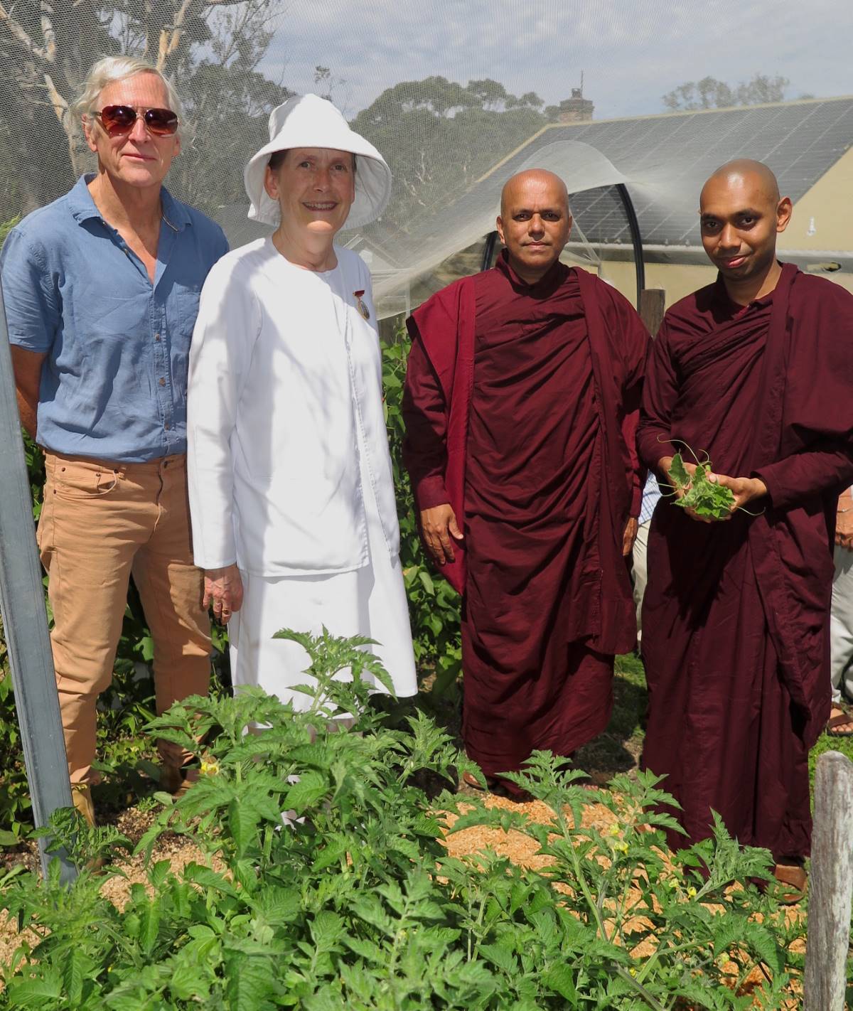 Principal gardener (Chris McDonald) and Jessica Yuille (Retreat Centre Coordinator) with visitors: Venerable Korvida and Venerable Mudhita.